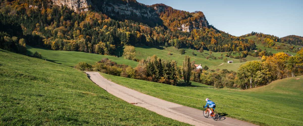 One male cyclist riding down Belchenpass in Kanton Baselland, Switzerland
